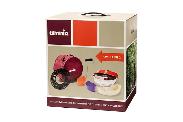 Win an Omnia Kit 2 Retail packaging of the Omnia Kit 2 showing the portable stovetop oven, burgundy storage bag, and accessories including the perforated tray, silicone moulds, and lifting handle designed for cooking while traveling or camping