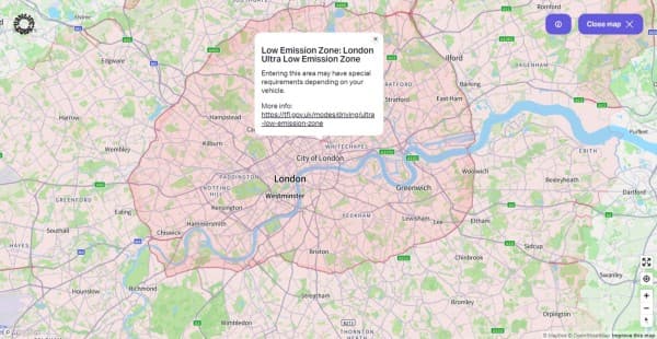 Low emission zone in London - vanlifezone.com/map Interactive map view from Vanlifezone highlighting the Low Emission Zone in London, with the Ultra Low Emission Zone clearly marked in pink overlay. Key areas such as the City of London, Westminster, Greenwich, and surrounding neighborhoods like Brixton, Chiswick, and Edgware are visible. The map includes river details, road networks like the A40 and M1, and green spaces throughout. An information pop-up provides details about the emission zone and a link for more information. Navigation tools and a 'Close map' button are included, along with Mapbox and OpenStreetMap credits.
