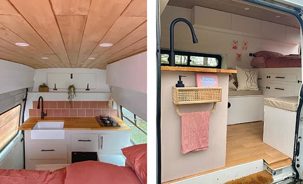 A cosy interior - @tamzin_in_transit 06/2022 Interior of @tamzin_in_transit's converted 2011 Ford Transit van, showcasing a cozy and stylish van life design. The van features a wood-paneled ceiling, a compact kitchenette with pink tiles, a farmhouse sink, white cabinetry, and a small living area with a bench seat, ample storage, and decorative elements like throw pillows and a woven basket.