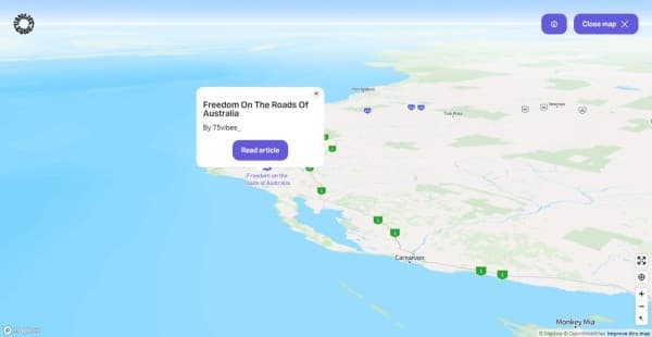 A link to @75vibes_' article in our journal - vanlifezone.com/map Interactive map from Vanlifezone featuring the coastal region of Western Australia with a focus on road travel. A pop-up window is displayed, promoting a journal article titled 'Freedom On The Roads Of Australia' by @75vibes_. The 'Read article' button within the pop-up links to the article in our journal online. The map shows key locations such as Port Hedland, Tom Price, and Monkey Mia, with a vast ocean backdrop. Navigation tools are present for user interaction, and the map credits Mapbox and OpenStreetMap in the corner.